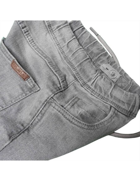 Pantaloni grigio per bambini con elastico alla caviglia.